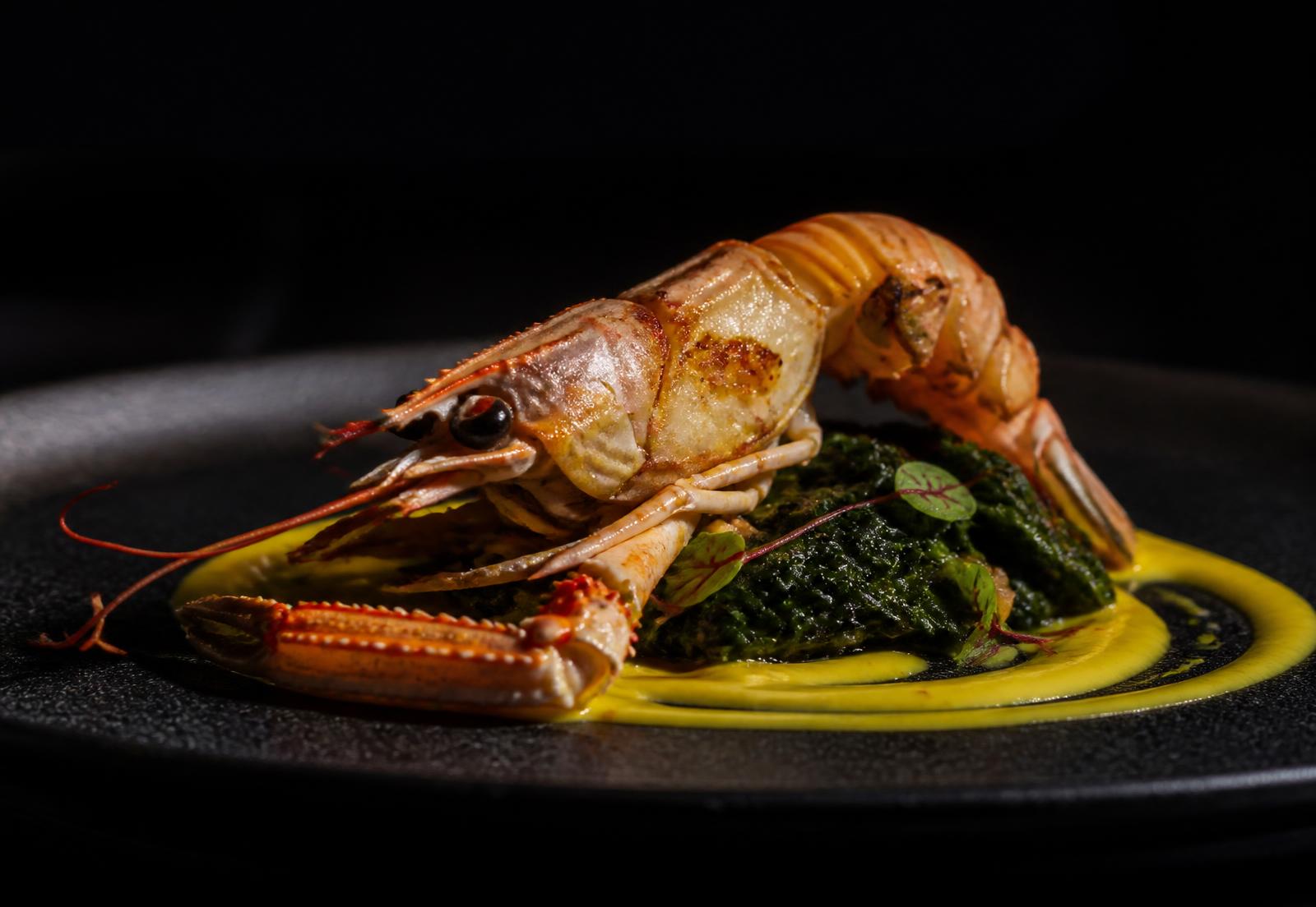 Seared langoustine plated at Bien Et Douillet